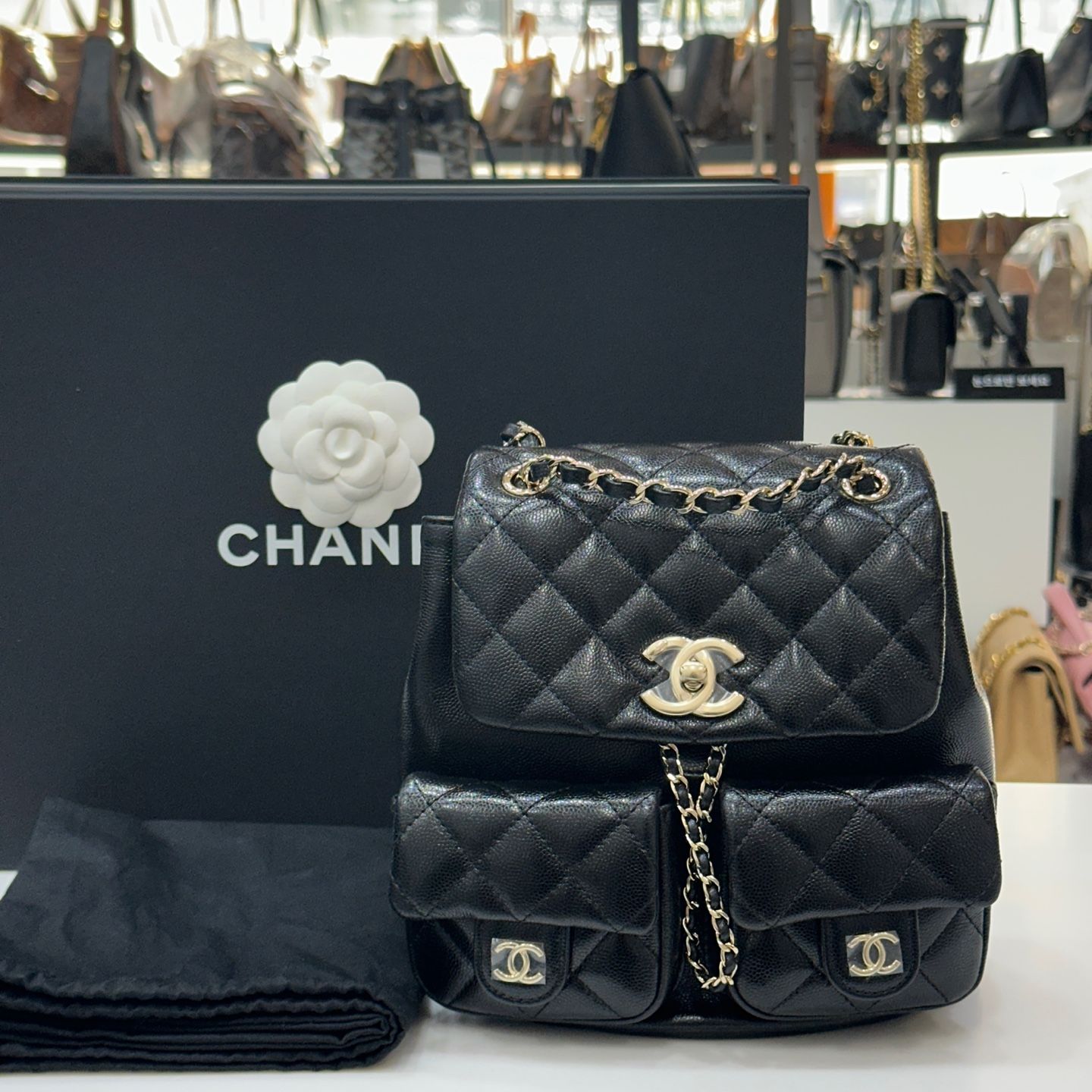 CHANEL Dual Pocket Medium Backpack Black Caviar Champagne Gold AS3860