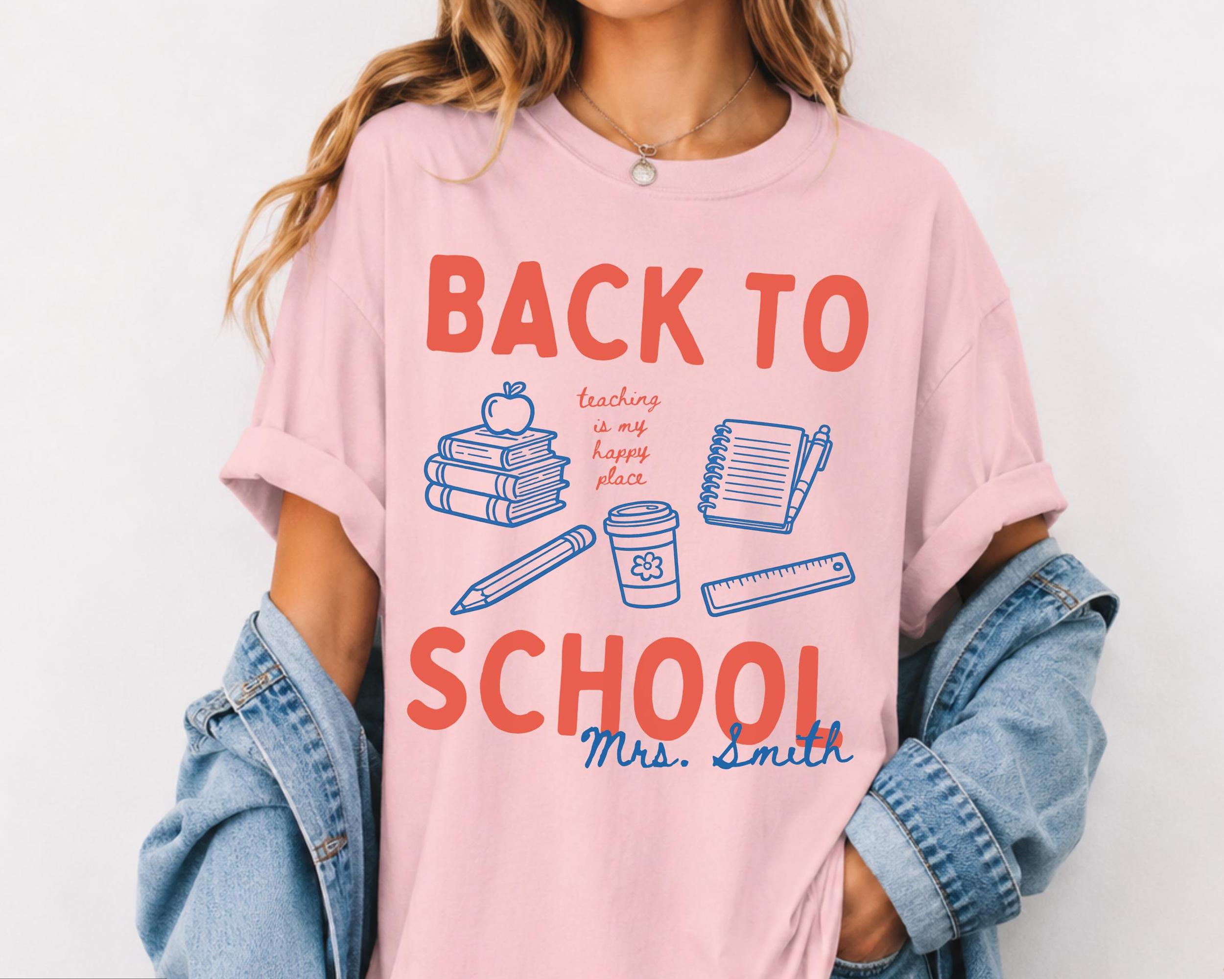 Custom Back To School Teaching Is My Happy Place Graphic T-Shirt For Teachers Retro Preppy Doodle Aesthetic Light Blue 100 Percent Cotton Comfort Colors Personalized Teacher Name Tee Elementary Educator Dream Team Squad Top
