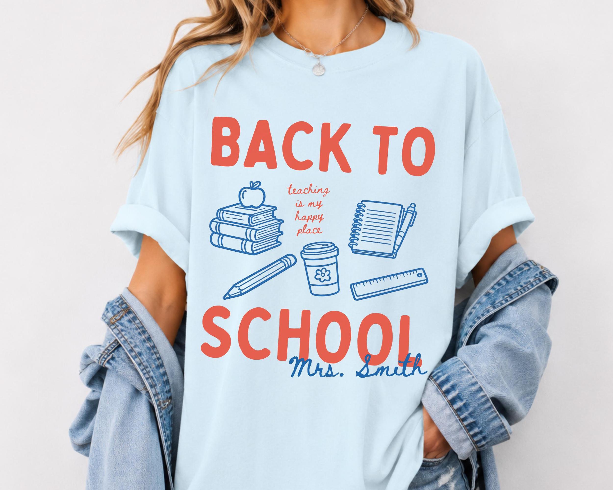 Custom Back To School Teaching Is My Happy Place Graphic T-Shirt For Teachers Retro Preppy Doodle Aesthetic Light Blue 100 Percent Cotton Comfort Colors Personalized Teacher Name Tee Elementary Educator Dream Team Squad Top 4