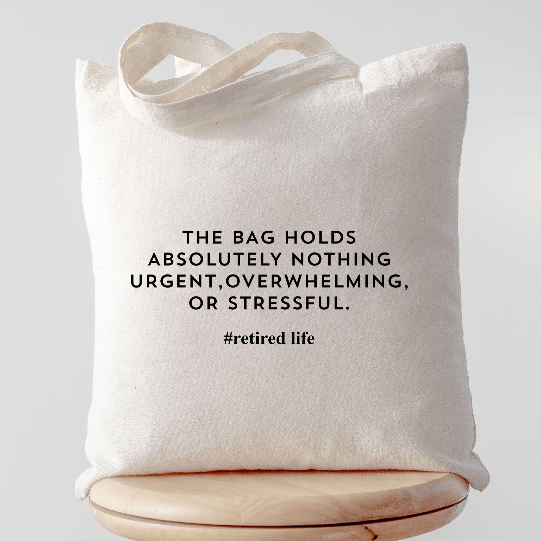 Funny Retired Life The Bag Holds Absolutely Nothing Urgent Canvas Tote Bag For Retirees Men Women Minimalist Aesthetic Natural Beige Cotton Retirement Gift Bag Coworker Leaving Present New Retired Christmas Gift Funny Retirement Tote Bag 2