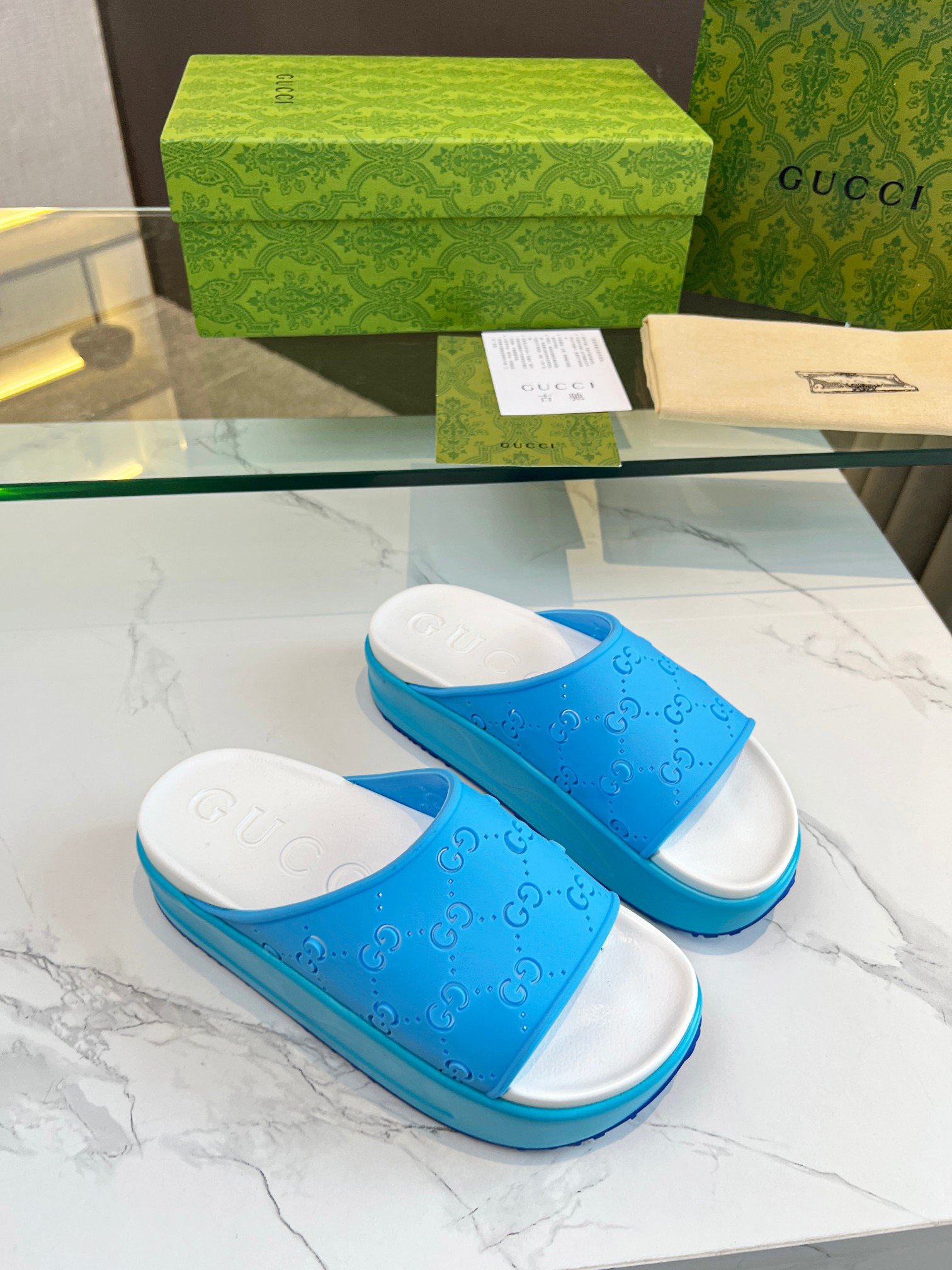 Gucci Perforated GG Slide Sandal In Blue Rubber