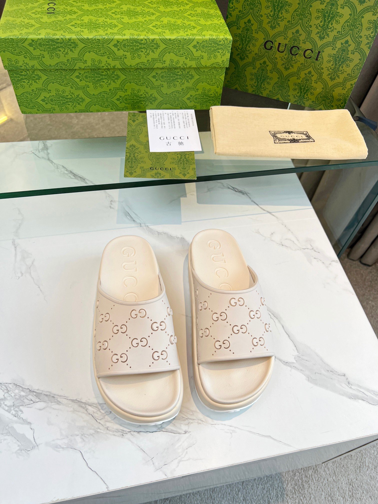 Gucci Perforated GG Slide Sandal In White Rubber