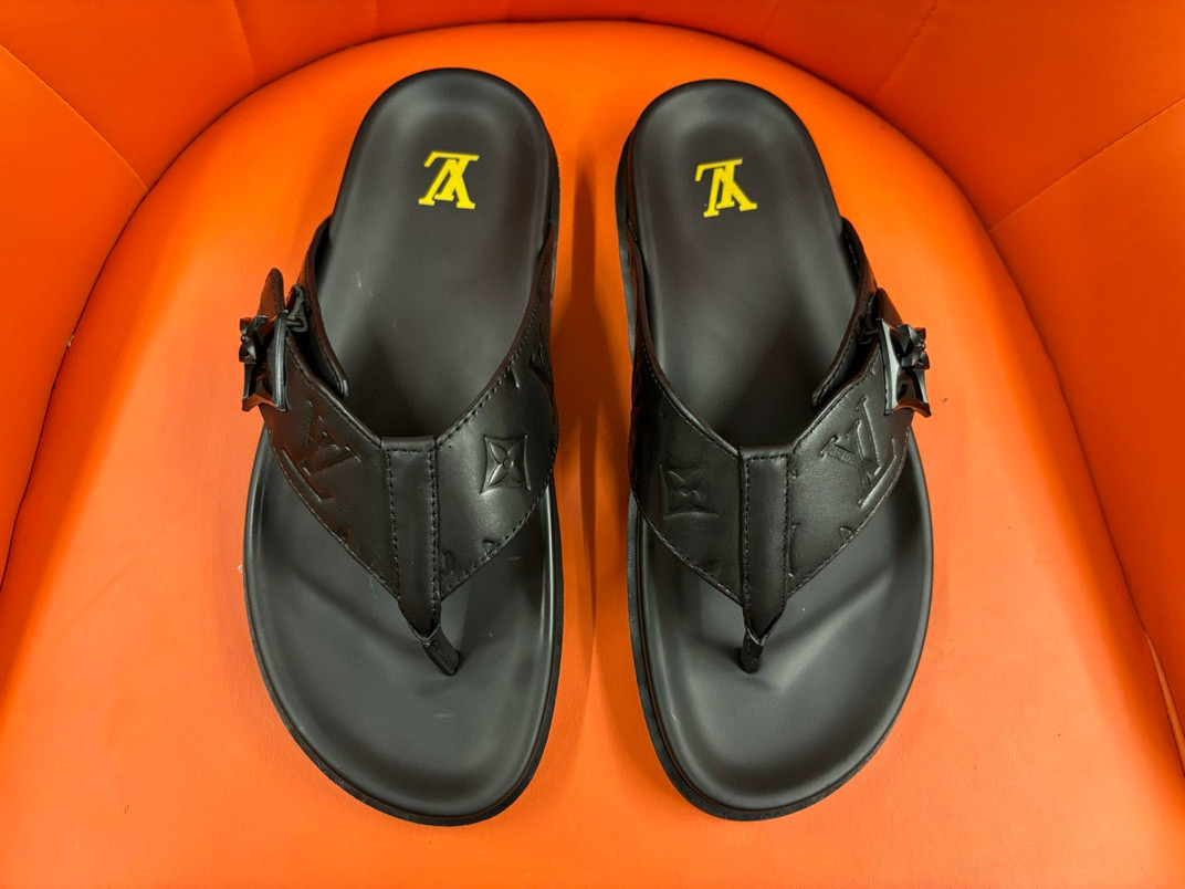 Louis Vuitton Flip-flops In Black Debossed