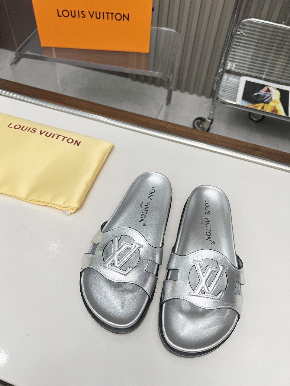 Louis Vuitton LV Isola Flat Comfort Mule In Silver Cowhide