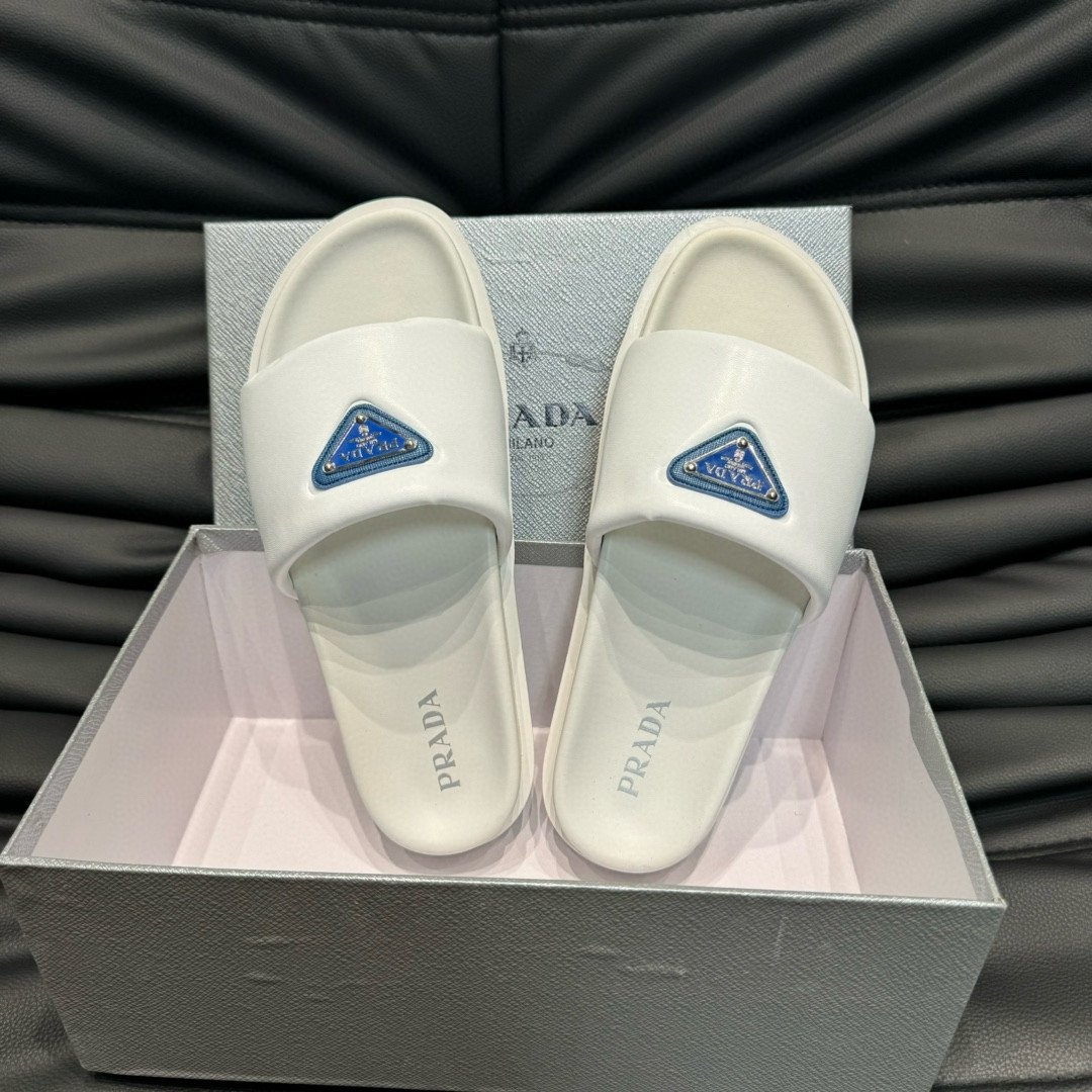 Prada Blue Triangle Logo Padded Nappa Leather Slides In White