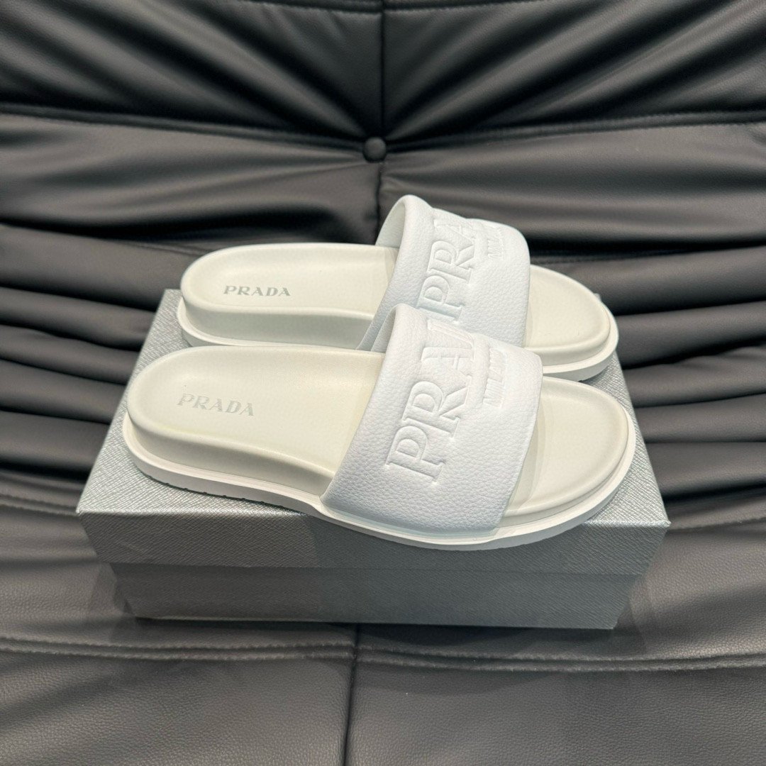 Prada Debossed Logo Slides In White
