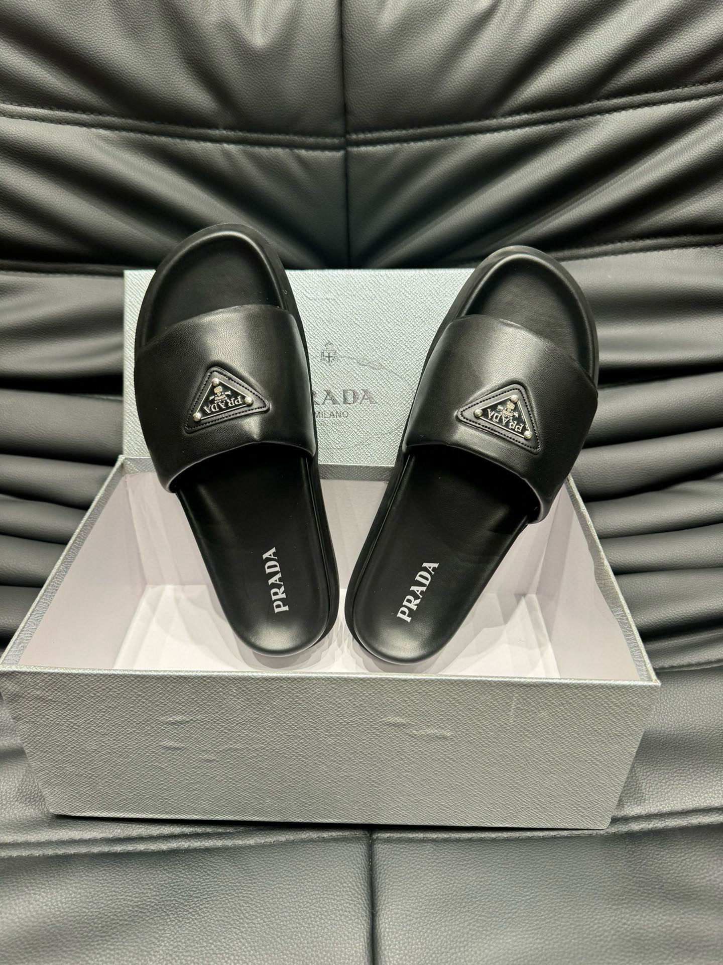 Prada Padded Nappa Leather Slides In Black