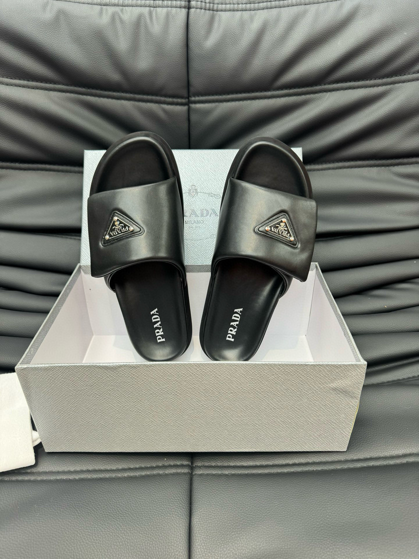 Prada Soft Padded Nappa Leather Slides In Black